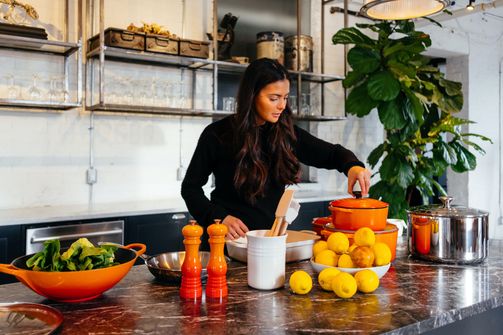 A Woman Crafting Nutrient-Rich Delights in the Kitchen A Woman Cooking Healthy Foods in the Kitchen